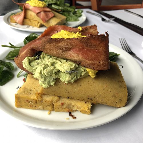 Polenta, tofu brouillé, guacamole et bacon at Vegano in Montreal