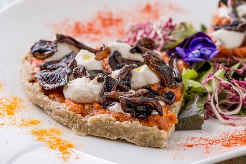 Raw Pizza with mushrooms at HappyRaw Natural Restaurant in Faenza