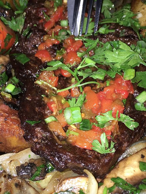 steak in a pan at Four One Six (416) in Tel Aviv