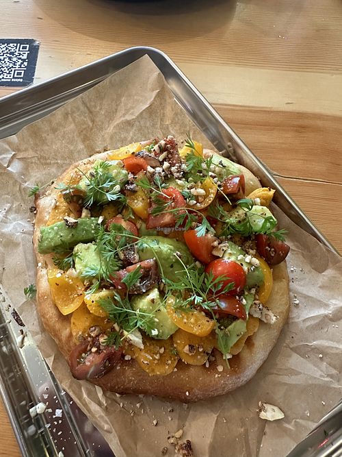 Baked pita with sweet potato hummus, avocado and cherry tomatoes  at Balans Bistro in Bratislava