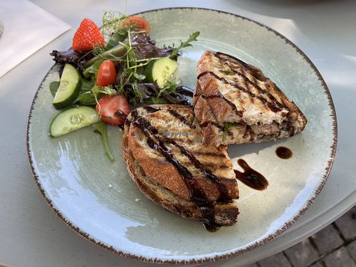 Grilled sourdough sandwich with mushrooms and truffle oil and a side salad   at Cafe Miro in Kristianstad