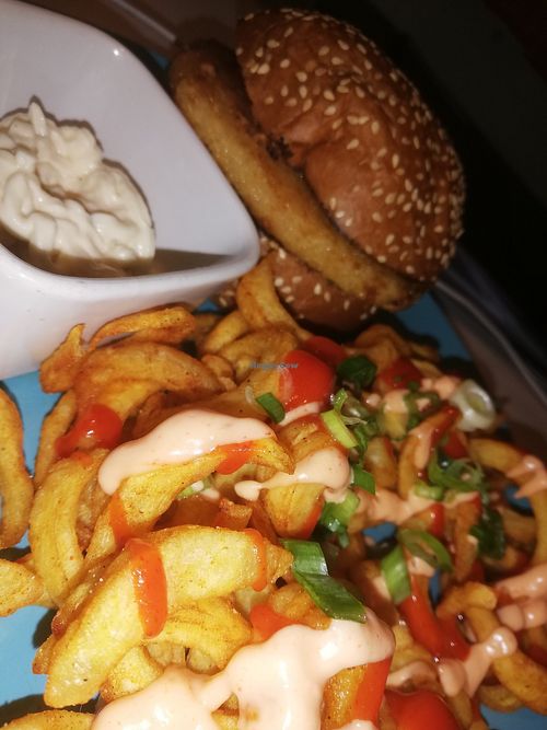 Katsu burger with curly fries at Nice N Sleazy - Old Fashioned Street Food in Glasgow