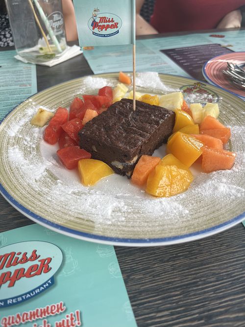 Vegan brownie with fruit  at Miss PeppeR in Barsbuettel