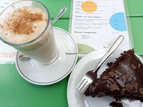chai latte with oat milk & deliciously moist vegan chocolate cake at Cafe Fridolin in Cologne