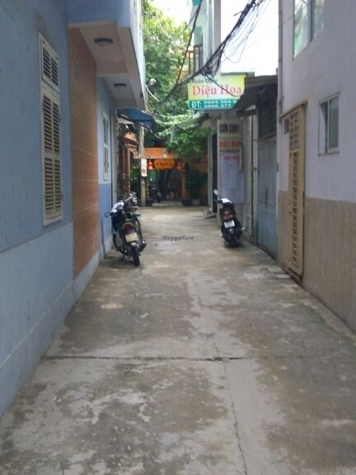 view down alley (with another restaurant on right) at Com Chay - Nguyen Du in Da Nang