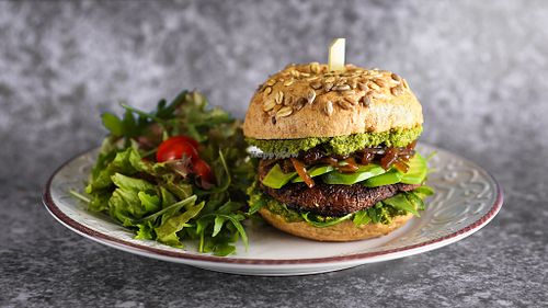 PORTOBELLO BURGER
Burger with portobello mushroom, baby rucola, caramelised onion, avocado and kale and almond pesto.
 at Crudo South in Glyfada