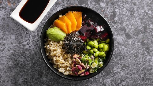 CRUDO POKE BOWL
Brown rice with baked beet, edamame beans, orange, spring onion, avocado wasabi, nori and homemade teriyaki sauce. 
 at Crudo South in Glyfada