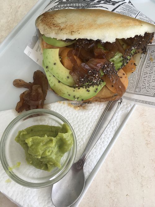 Venezuelan corn arepa with hummus, avocado, and vegan sausage at Aqui y Ahora  in Lanzarote