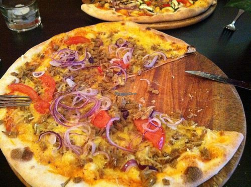 Vegan pizza amore (?? with vegan minced meat, fresh tomato and onions.. and vegan cheese). Very filling and tasty! at Roma Ristorante Pizzeria in Leipzig