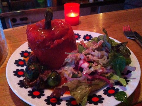 Stuffed bell pepper. Tasty and nicely presented with roasted brussels sprouts and salad. Well spiced tomato-y rice in the pepper.  at Kulthum in Leipzig
