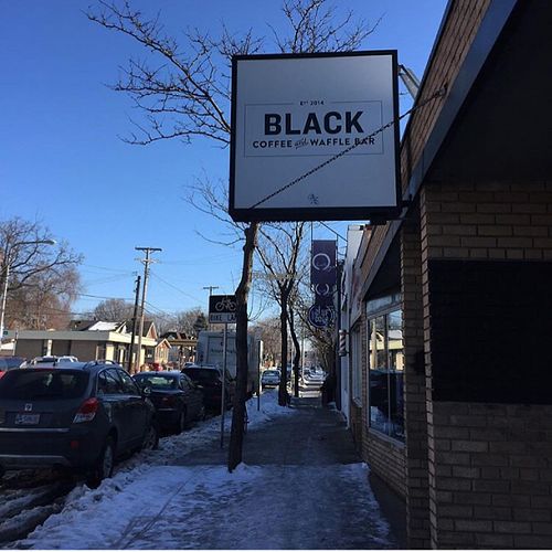 entrance w street parking out front  at Black Coffee and Waffle Bar in Minneapolis