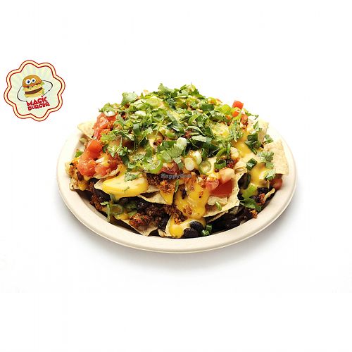 NACHO PLATE
Nacho chips, Vegan cheese sauce, Quinoa, Black beans, Tomato, Guacamole, Soy cream, Spring onion, Cilantro 
 at Magic Burger in Budapest