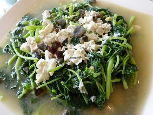 stirred fried spinach with century egg and salted egg at ThaiPan Restaurant in East Singapore