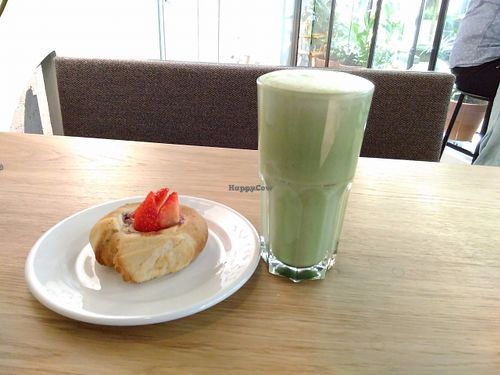Vegan pastry and macha latte in oatmilk at Well  in Helsinki
