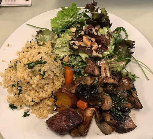 bulgar wheat with sautéed mushrooms , baked sweet potatoes with carrots and a side salad at Organi Chiado in Lisbon