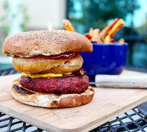 This Vegan Revenant Burger will blow your mind! Vegan Mushroom Bacon, Cashew Based Onion Ring, Vegan BBQ Sauce, House-Made Cashew Cheese, & Beyond Meat Burger! at The Blaq Square in Valencia