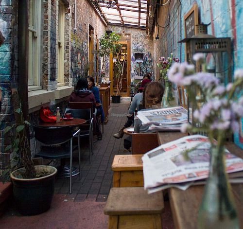Between Bookstore & Courtyard at Sappho Books Cafe & Bar in Glebe