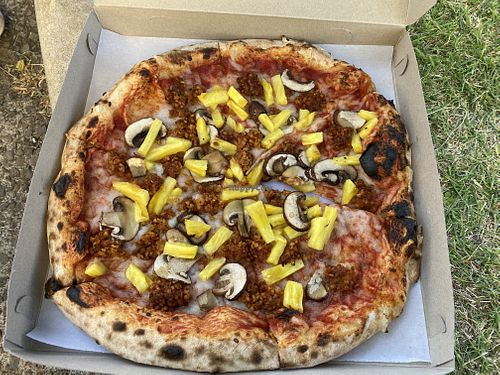 Cheese pizza with sausage, pineapple, and mushrooms   at Floralia in Honolulu