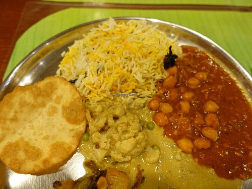 wide selection of vegetables dishes with bread and rice at Annalakshmi Janatha in Central Singapore