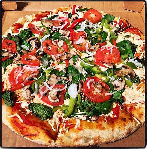 Fresh vegan pizza to-go  at Lucky's Market in West Melbourne