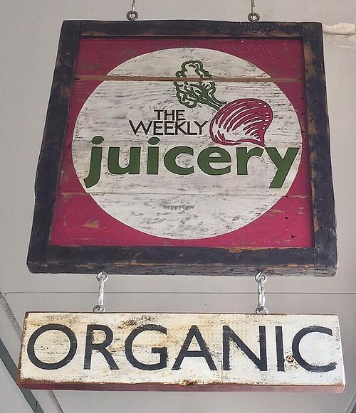 sign at entrance at The Weekly Juicery - Palomar Centre in Lexington