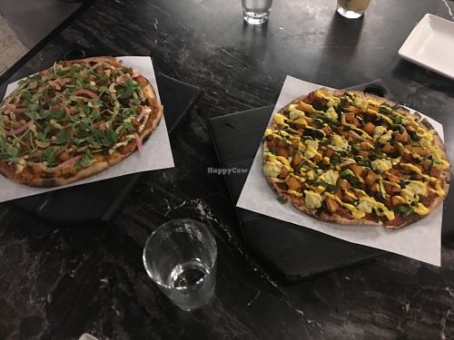Two wonderful pizzas, including a curry pi! at Virtuous Pie in Portland