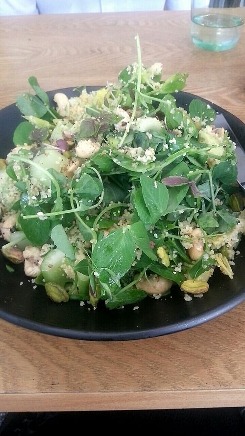 Salad made vegan by request. Quinoa, pine nuts, leafy greens at DEW: Drink Eat Work in Adelaide
