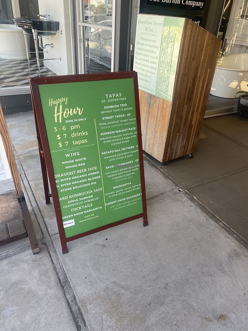 Upon Arrival w/Signage for Happy Hour Tapas  at Green Door Cafe in La Jolla