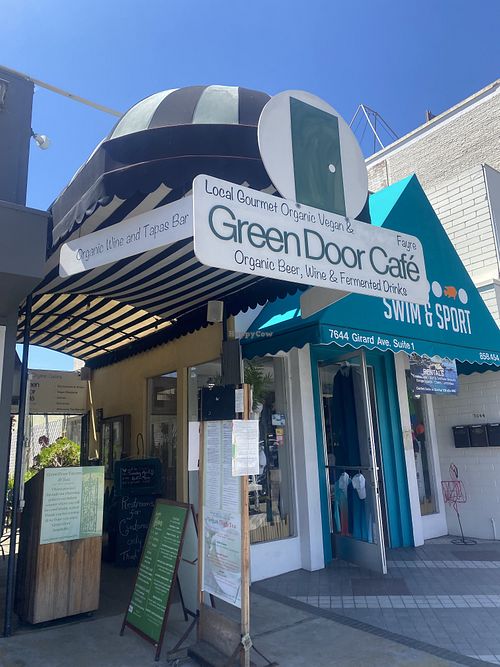 Signage from Street for Green Door Café  at Green Door Cafe in La Jolla
