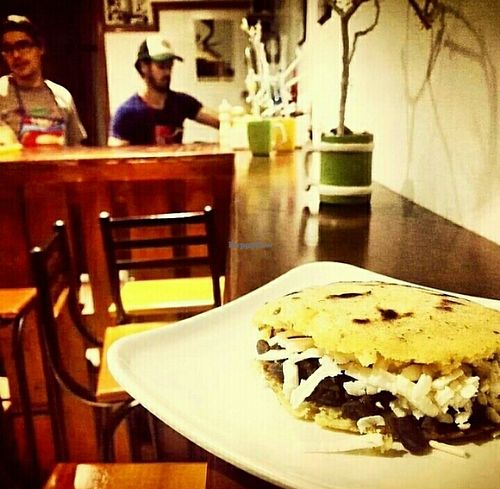 Venezuelan arepa fill with black beans and cheese at Wadaka Bites in Bogota