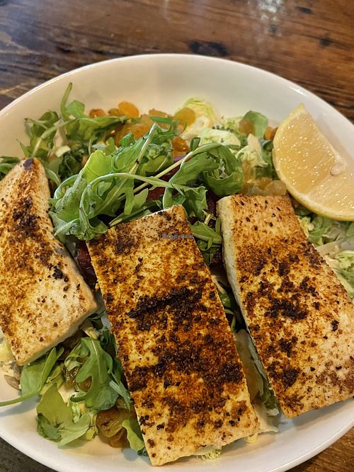 Salad with shaved Brussels and blackened tofu on top  at Prison City Pub and Brewery in Auburn
