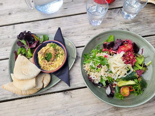 Hummus with pitta (left) & vegan salad bowl at Caffi Caban Cafe in Brynrefail