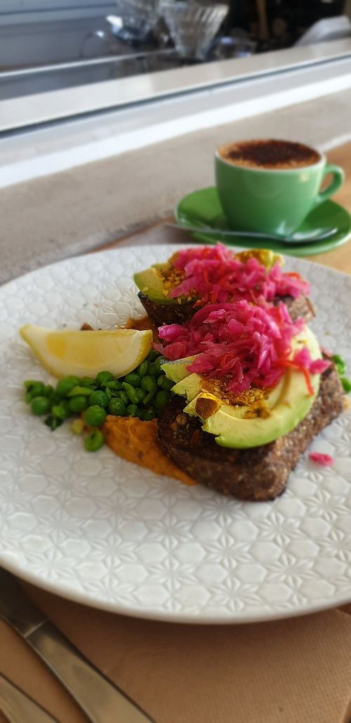 Housemade seeded pumpkin bread, avo, hummus... at KYOsk Cafe in Ocean Grove