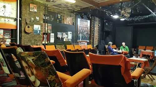 ample seating area (turns into a theatre also) at Manchester Vegan Cafe in Manchester