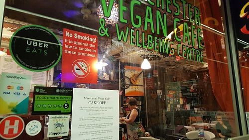 Manchester Vegan Centre receives its Happy Cow Excellent Reviews Sticker at Manchester Vegan Cafe in Manchester