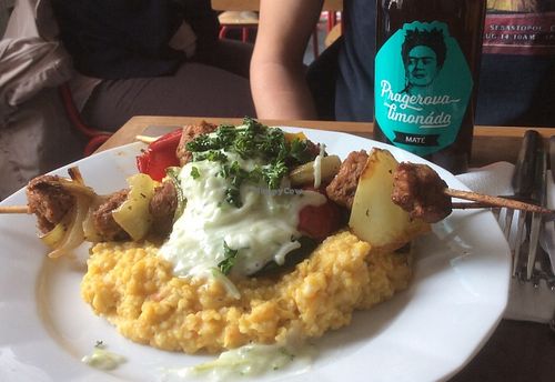 Vegetable kebabs with a millet base and garlic sauce. Super good! at Kuchařky bez Domova in Prague