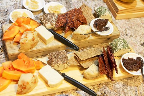 Vegan Cheeze Board
Fresh goat style cheezes rolled in mixed herbs and caraway seeds. Cultured cheezes mixed with chopped apricots and cracked black pepper. And a moxarella.
Served with raw cracker biscuits, fresh papaya and a raw raisin and ginger relish. at Green & Vegan - Pop-Up in Cape Town