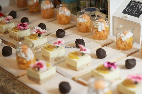 Plating a trio of desserts.
Lemon Cheezecake, Orange Chocolate Truffles and Melon Parfait with Carrot Foam at Green & Vegan - Pop-Up in Cape Town