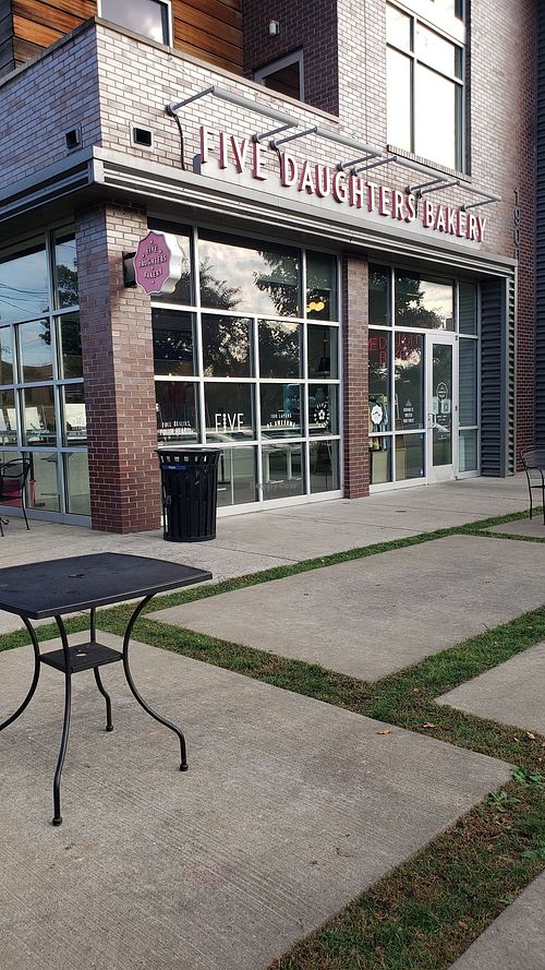 Store front in a center with 8ce cream store near by at Five Daughters Bakery - Eastland Ave in Nashville