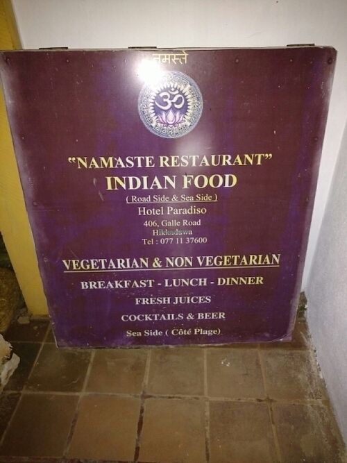 Tucked away sign mentioning vegetarian food at Hotel Paradiso in Hikkaduwa