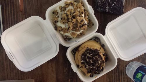 Top is marshmallow topping and cookie dough, bottom is peanut butter and oreos. Brownie in top right corner. at Cinnaholic in San Diego