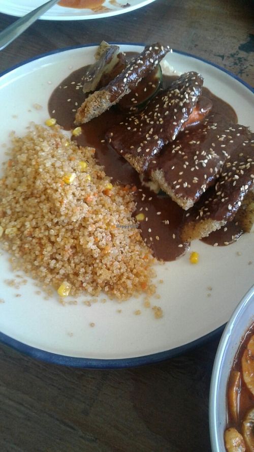 Milanesa en mole sauce with quinoa  at Inspiracion 9 in Tijuana