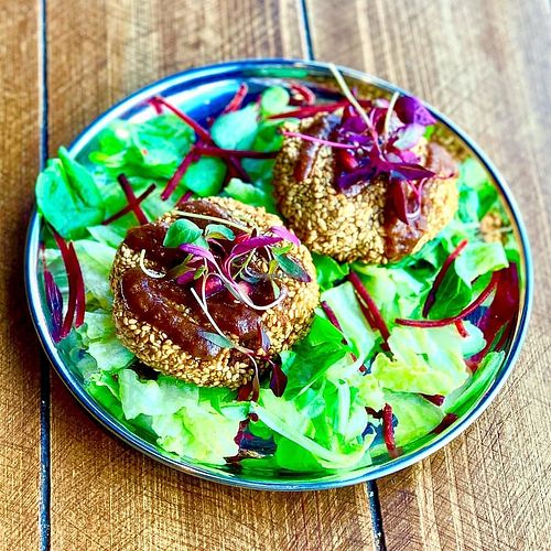 Spiced potato covered in sesame. at Manjus in Brighton