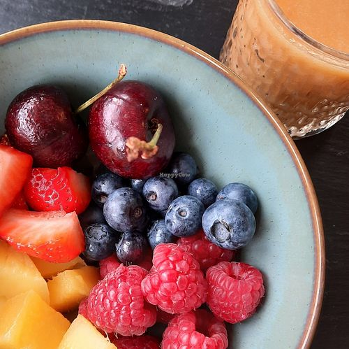 A selection of berries and other fruits and homemade smoothie at Sandburne Vegetarian Guest House in Keswick