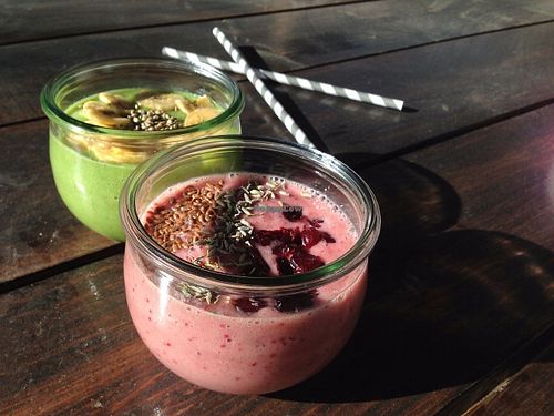Smoothie bowls: berry-banana with lavender and pear-cucmber-lemon with banana chips. Paper straws! at Marta Kohvik in Tallinn