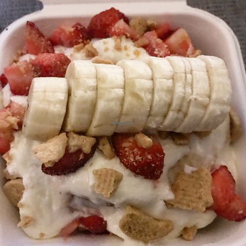 Roll with cream cheese frosting, topped with graham crackers, banana & strawberries.  at Cinnaholic - Centennial in Las Vegas