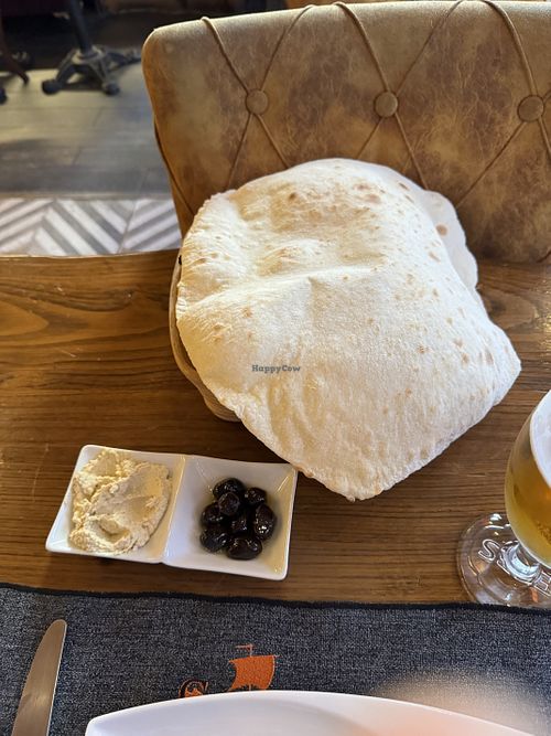 Freshly made bread with hummus and olives oil  at Constantine's Ark in Istanbul