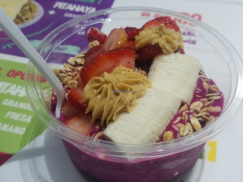 Dragon fruit bowl with almond butter and fruit at Buenazo in Jaco