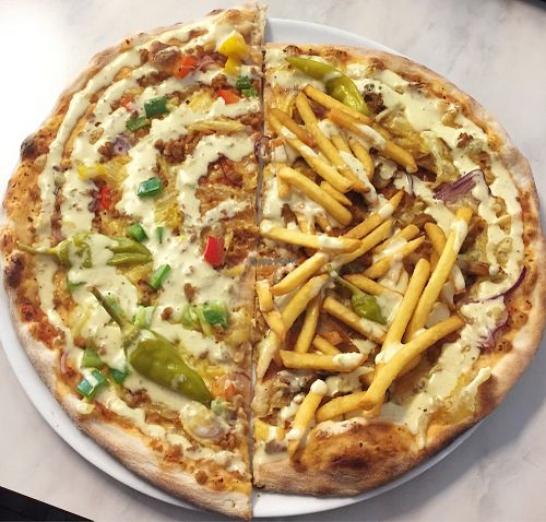 Half Mexican pizza, half Pizza Burger pizza  at Pizza Roma in Gothenburg