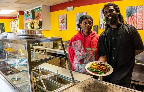 the hostess and chef with my meal at Ninth Square Market Caribbean Style in New Haven